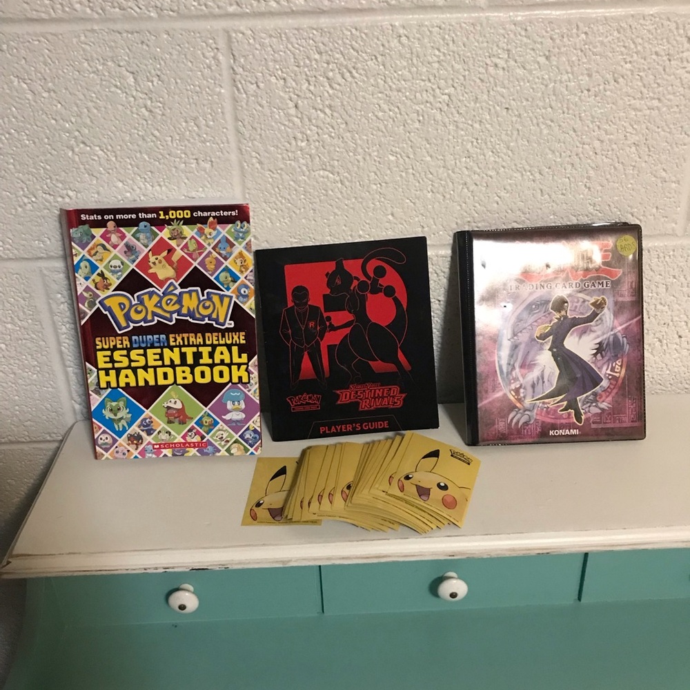Pokémon books and card sleeves bundle